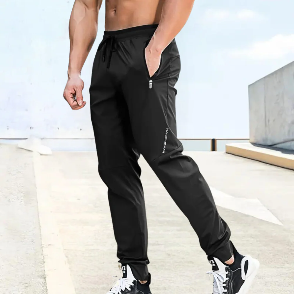 Lightweight men's athletic pants – relaxed fit, stretchy fabric, for summer activities - Image 2
